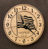 Round oak clock with a lasered American flag and black background with the words "Land of the free"  - 6.5" size