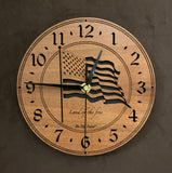 8" Round Walnut clock with a laser-cut flag in the middle, the words, "Land of the Free" beneath it, and the numbers 1-12 cut through around the perimeter.
