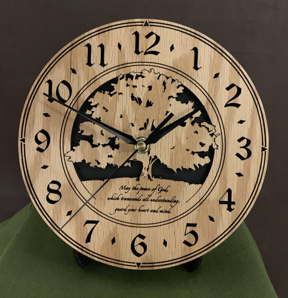 Round Oak clock with a tree and the words,