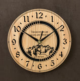 Round oak clock with a mountain and the words, "The mountains are calling and I must go" lasered in the face - larger sizes