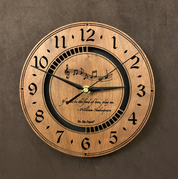 Round walnut clock with music notes and the words, 