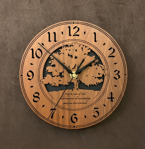 Round Walnut clock with a tree and the words,
