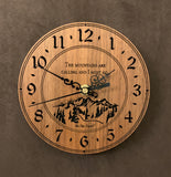 Round walnut clock with a mountain and the words, "The mountains are calling and I must go" lasered in the face - 6.5" size