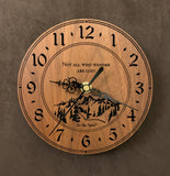 Round walnut clock with a mountain and the words, "Not all who wander are lost" lasered in the face - 6.5" size