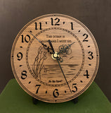 Round walnut clock with an ocean scene of sun, birds and ripples in the water along with the words, "The ocean is calling and I must go" lasered in the face - 6.5" on easel