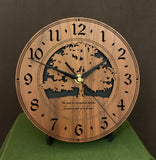 Round walnut clock with a tree and the words, "The good we accomplish together becomes a part of us forever" lasered on face - 8" on easel