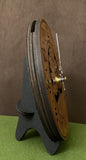 Round walnut clock with a tree and the words, "The good we accomplish together becomes a part of us forever" lasered on face - 6.5" on easel side view showing 3 layers of wood