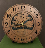 Round walnut clock with a tree and the words, "It is well with my soul" lasered on face - 8" on easel