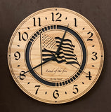 Round oak clock with a lasered American flag and black background with the words "Land of the free"  - largest sizes