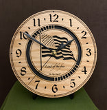 Round oak clock with a lasered American flag and black background with the words "Land of the free"  - 9.1" on easel