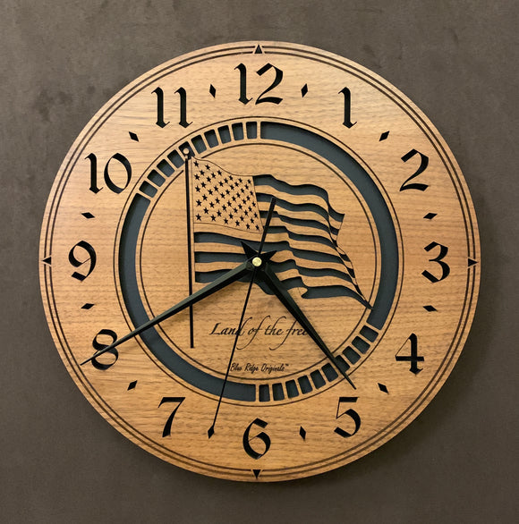 Larger sizes of the round Walnut clock with a laser-cut flag in the middle, the words, 